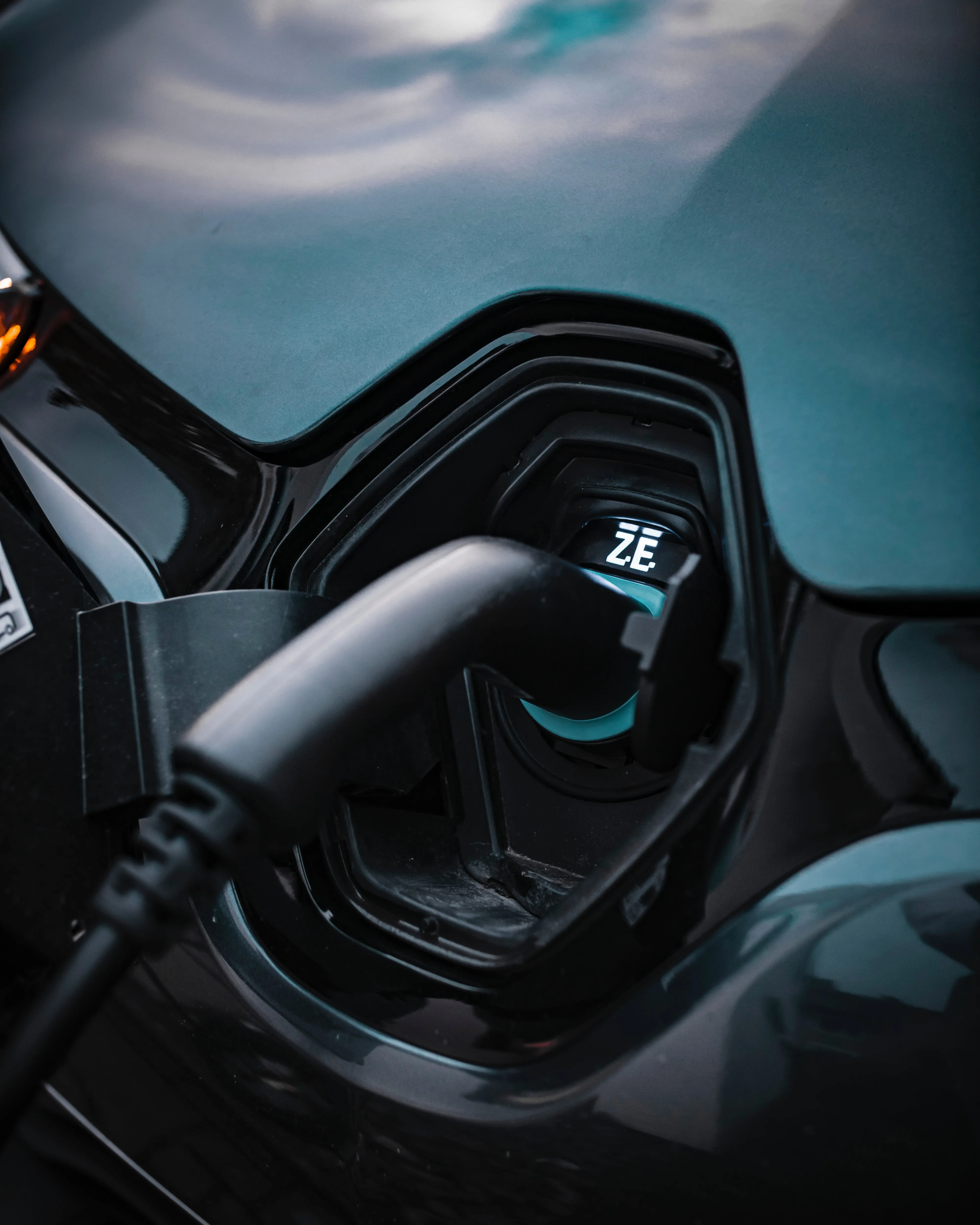 EV charging cable connected to a vehicle — illustrating the user-facing simplicity HeyCharge delivers.